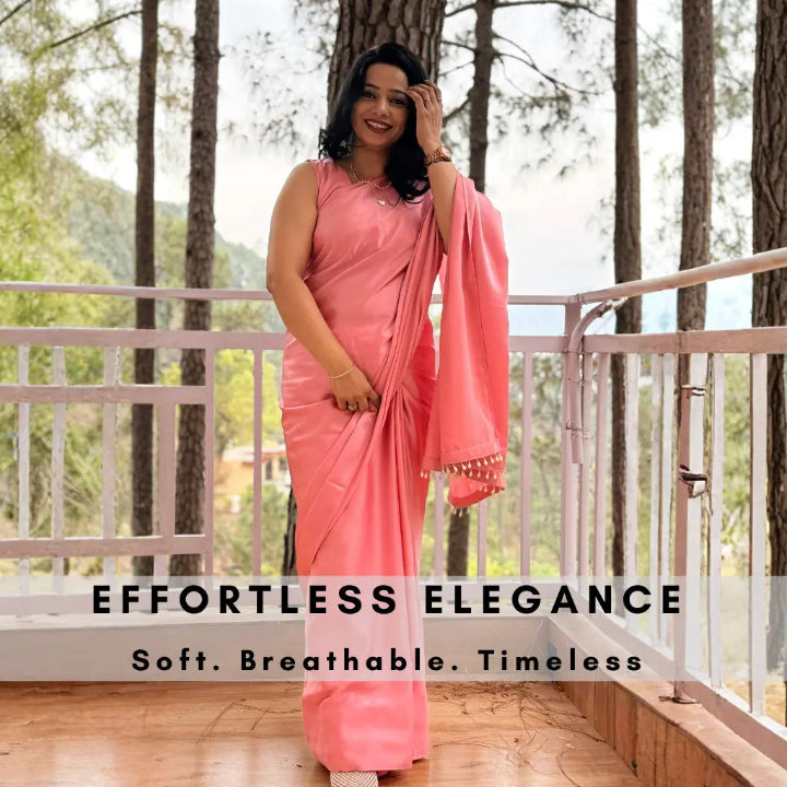 Woman in a pink saree standing on a balcony with trees in the background, text 'Effortless Elegance' displayed.