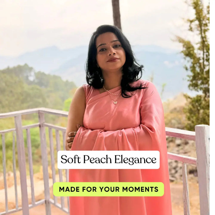 Woman in a pink dress standing on a balcony with scenic background