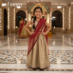 Young girl in a traditional outfit standing in a decorated indoor setting with 'pehnara' branding.