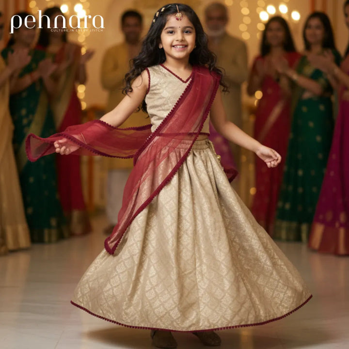 Young girl in traditional attire with a blurred background of people in colorful clothing.