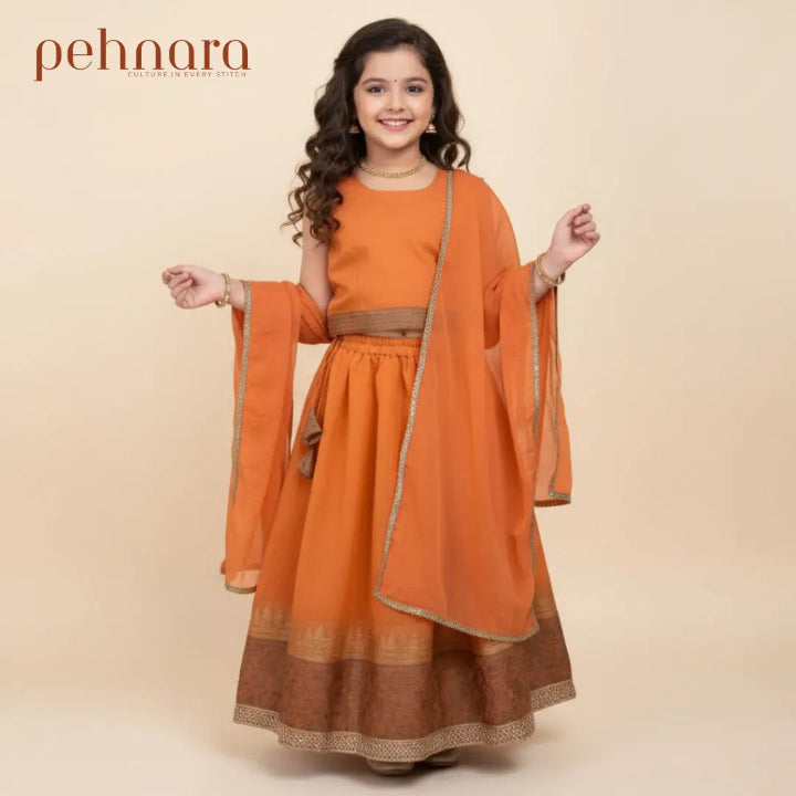 Orange traditional outfit with matching dupatta on a beige background, featuring the brand 'pehnara'.