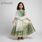 Young girl wearing a green and white traditional outfit with 'pehnara' branding.